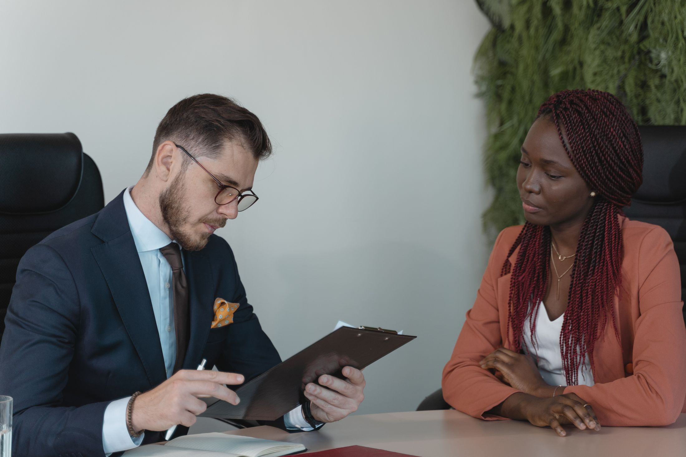 Recruiter reviewing a candidate's resume during a job interview